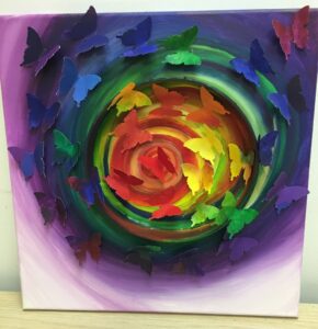 Abstract painting with vibrant swirling colors and green accents.